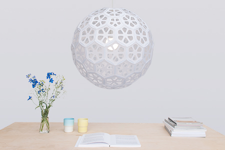 Flower Ball is a series of bright sphere pendant lamps with luminous organic pattern.