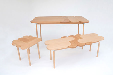 Moku Plus is a casual collection of wood tables and seating inspired by an interlocking 