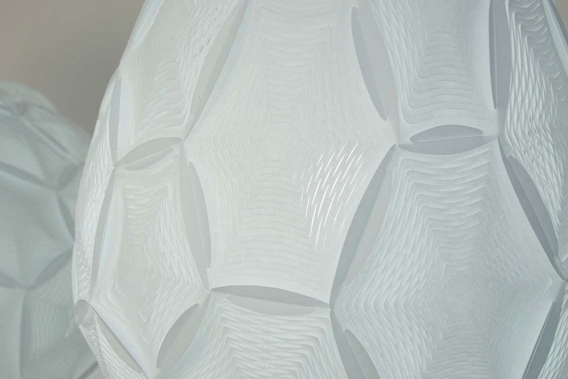 Airy Small Teardrop ceiling Lamp zoom-in detail of the white perforated laminated rice paper lampshade 