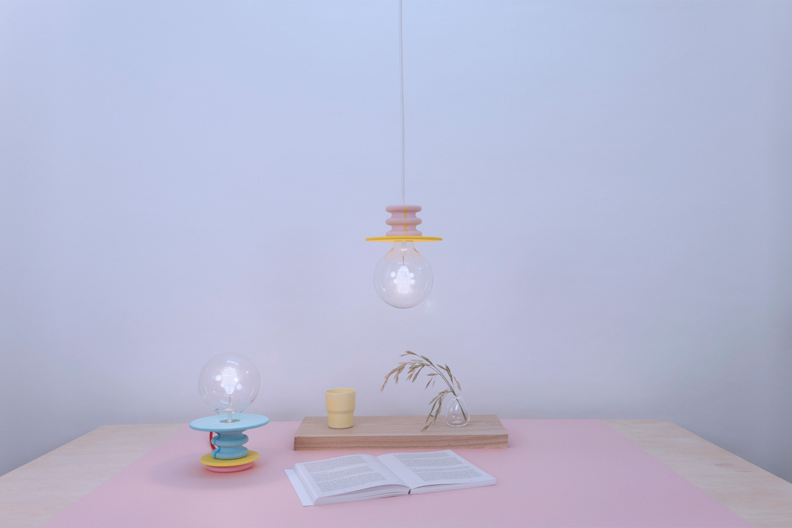 Frutti yellow and pink pendant light and Frutti in cyon and yellow stand lamp in interior setting