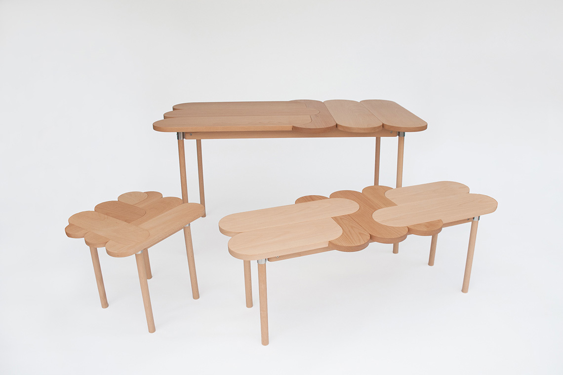 Moku Plus is a casual collection of wood tables and seating inspired by an interlocking technique
