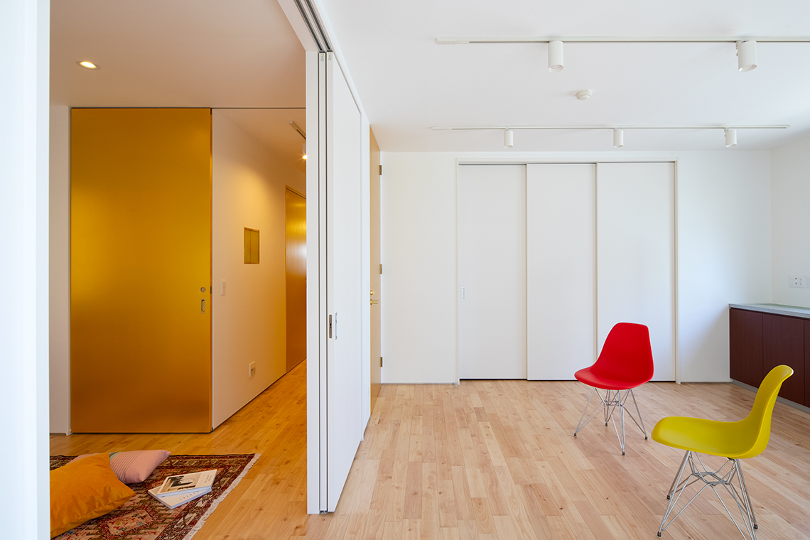 Large Gold sliding door separated spa interior from the rest of the second floor interior in Kitano House Renovation Project by 24d-studio.