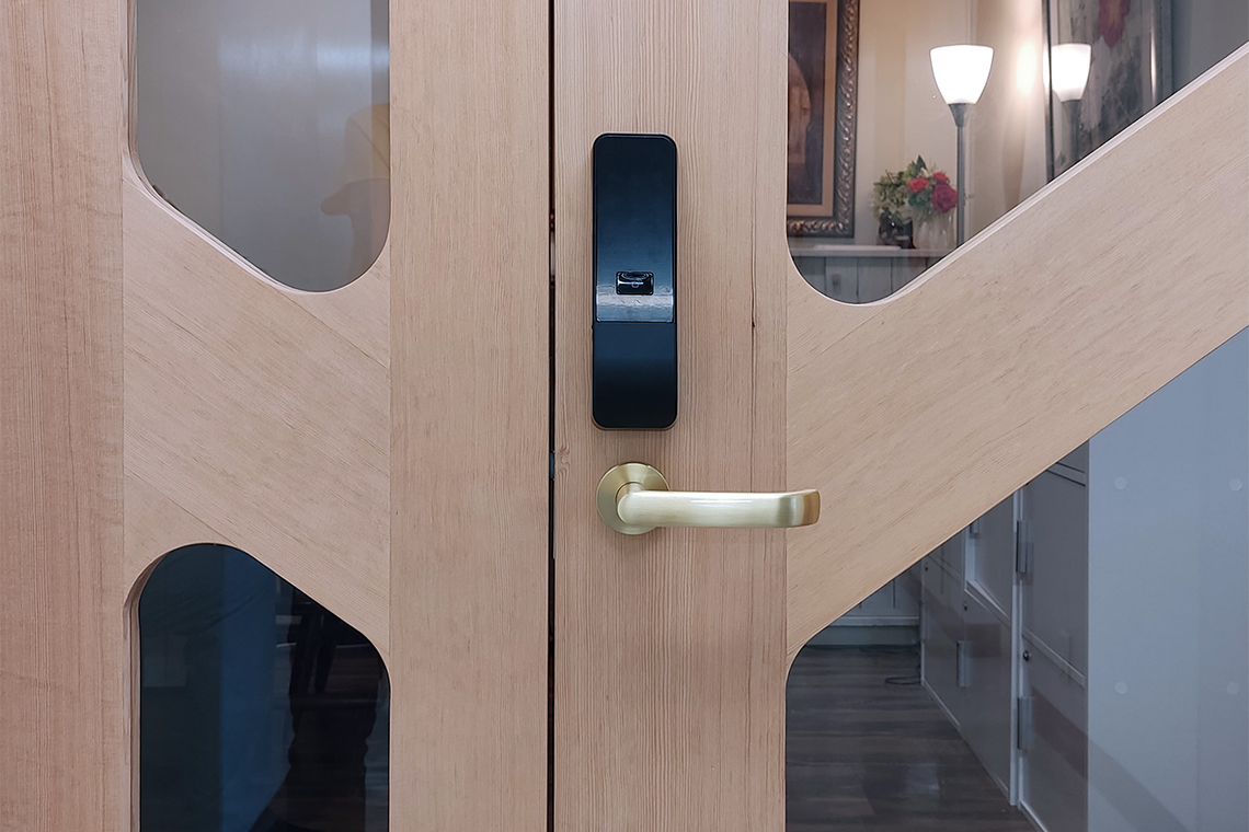 Arsnova Music studio entrance uses smart electronic system lock and brass hardware 